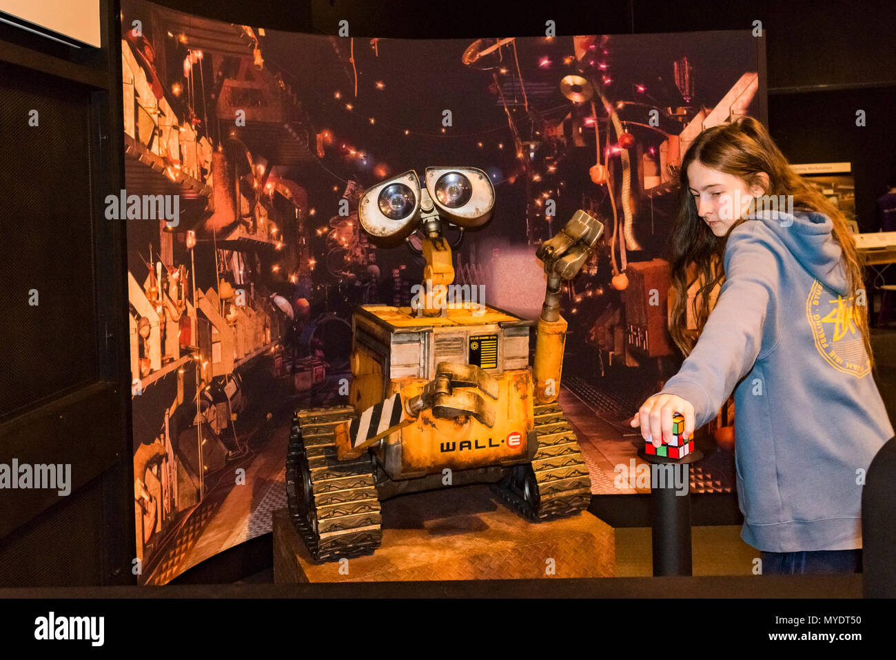 Boy interacts with Wall-E, Pixar exhibit, Telus World of Science, Vancouver, British Columbia, Canada. Stock Photo