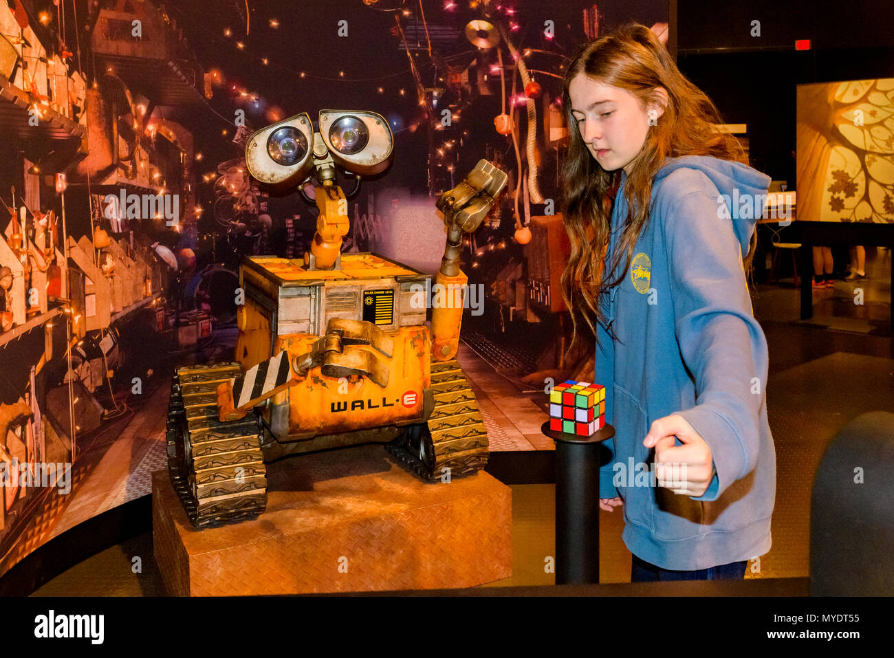 Boy interacts with Wall-E, Pixar exhibit, Telus World of Science, Vancouver, British Columbia, Canada. Stock Photo