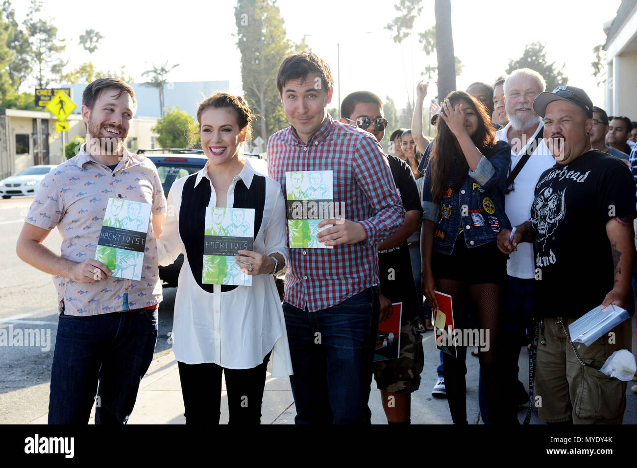 Alyssa Milano,  Jackson Lanzing, Colin Kelly  111 at her book signing for 'The Hacktivist Vol.2 at the Comic Bug in Manhattan Beach. July 29, 2015 Stock Photo