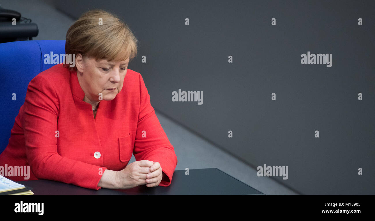 Berlin, Germany. 7th June, 2018. German chancellor Angela Merkel (Christian Democratic Union) during a plenary meeting of the German parliament at the Reichstag building. Main themes of the 36th session of the 19th legislature period include new refugee family reunion laws, foreign deployments of the German army, rising rent prices in Germany as well as a committee of inquiry requested by the Free Democratic Party concerning the Federal Office for Migration and Refugees (BAMF) affair. Credit: dpa picture alliance/Alamy Live News Stock Photo