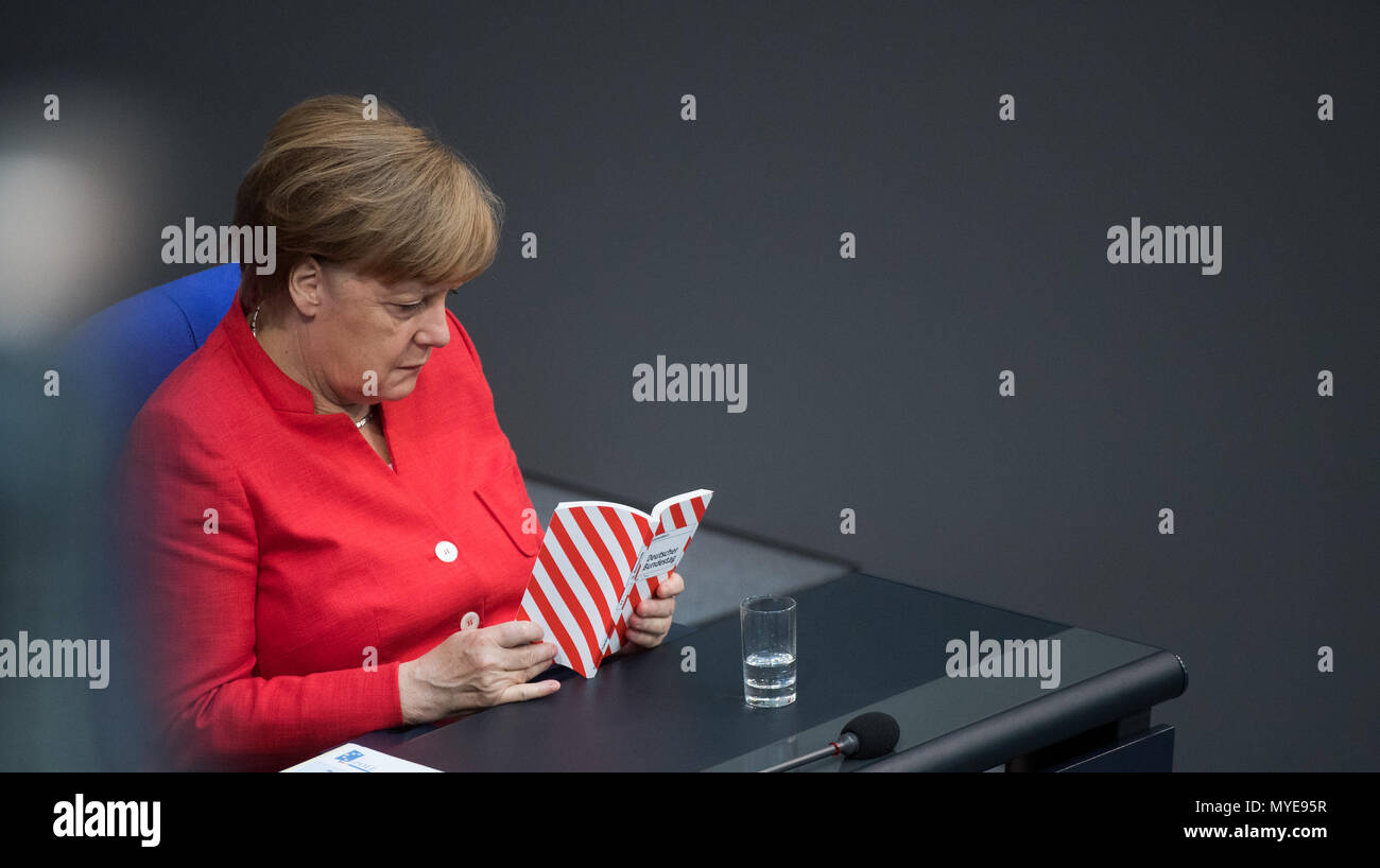 Berlin, Germany. 7th June, 2018. German chancellor Angela Merkel (Christian Democratic Union) during a plenary meeting of the German parliament at the Reichstag building. Main themes of the 36th session of the 19th legislature period include new refugee family reunion laws, foreign deployments of the German army, rising rent prices in Germany as well as a committee of inquiry requested by the Free Democratic Party concerning the Federal Office for Migration and Refugees (BAMF) affair. Credit: dpa picture alliance/Alamy Live News Stock Photo
