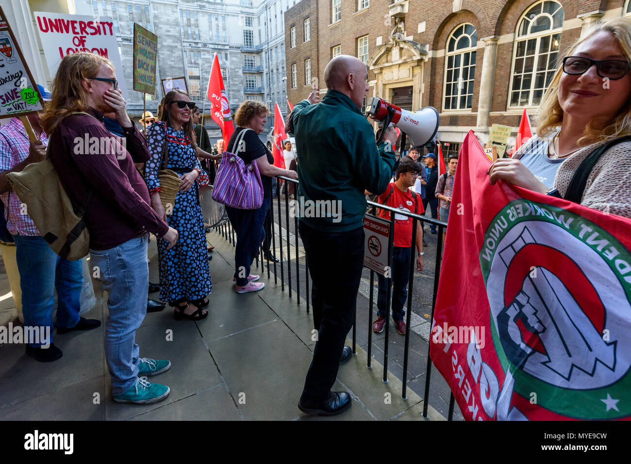 June 6, 2018 - London, UK. 6th May 2018. Grim Chip (Chip Hamer) of Poetry on the Picket Line perfroms on the steps of Stewart House at the University of London where cleaners, porters, security officers, receptionists, gardeners, post room staff and audiovisual staff on strike today and supporters were there for a lively rally. The Independent Workers Union of Great Britain is the largest union in the University of London central administration buildings but its members there are employed by a number of outsourcing companies, working with worse pension, holiday pay, sick pay, maternity pay an Stock Photo