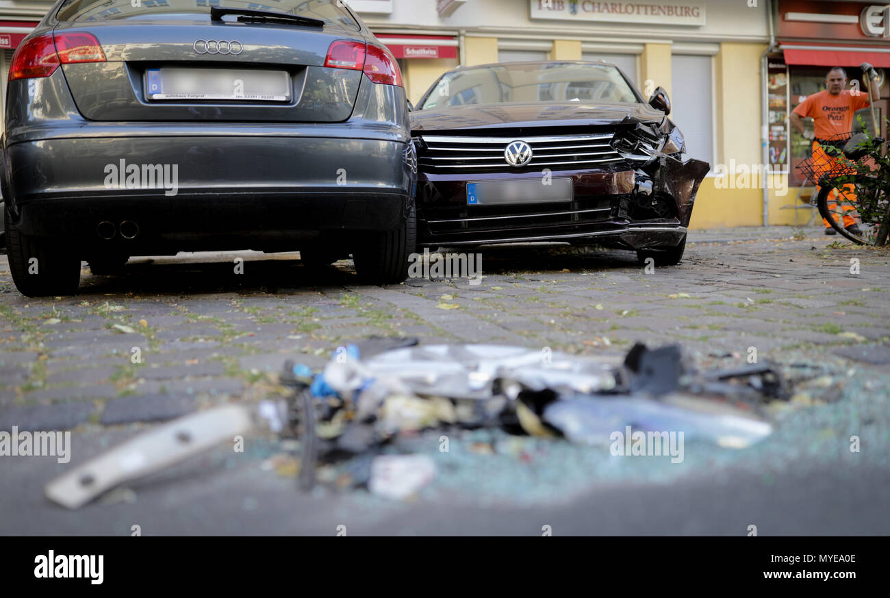 7 June 2018, Berlin, Germany Trash and two crashed cars stand at the accident site. A car chase