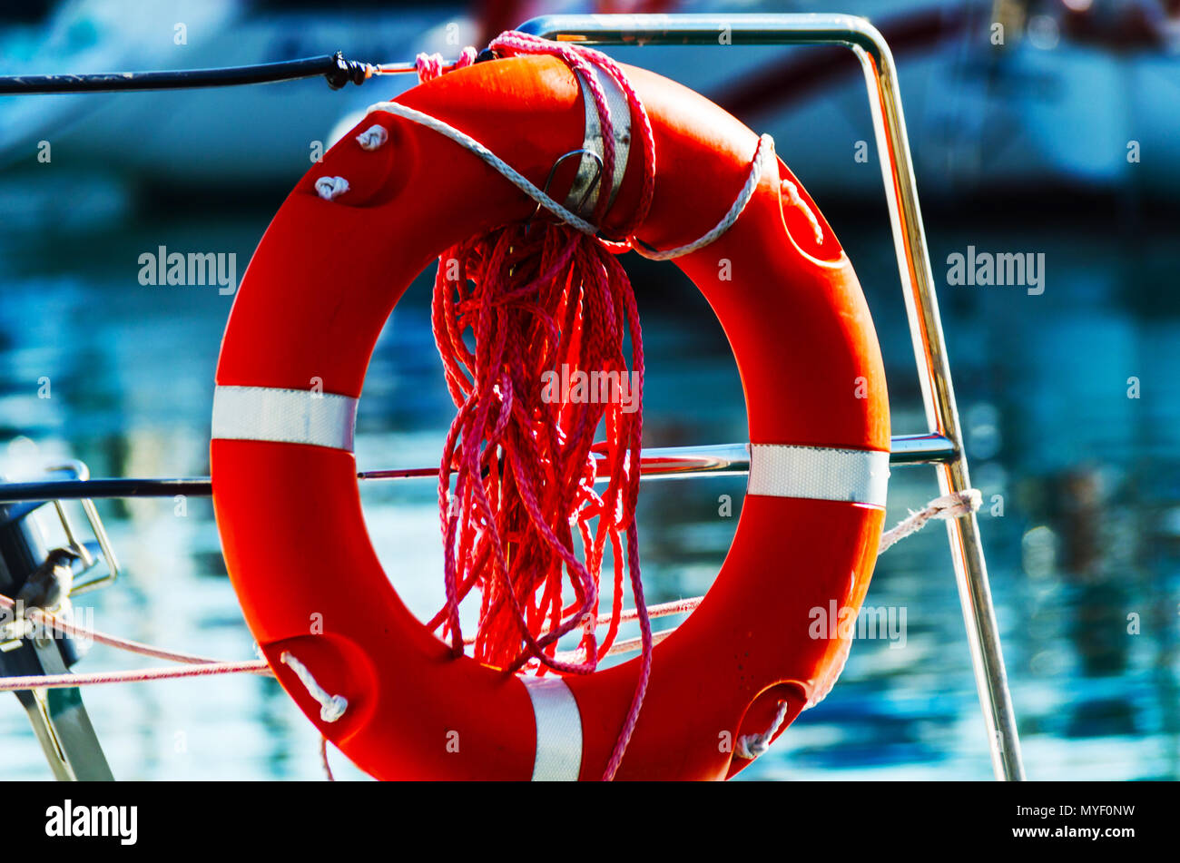 Orange lifebuoy on the side of the boat, an essential tool life-saving ...