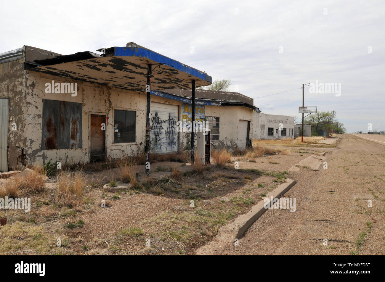 Abandoned businesses, including a gas station, stand along old Route 66