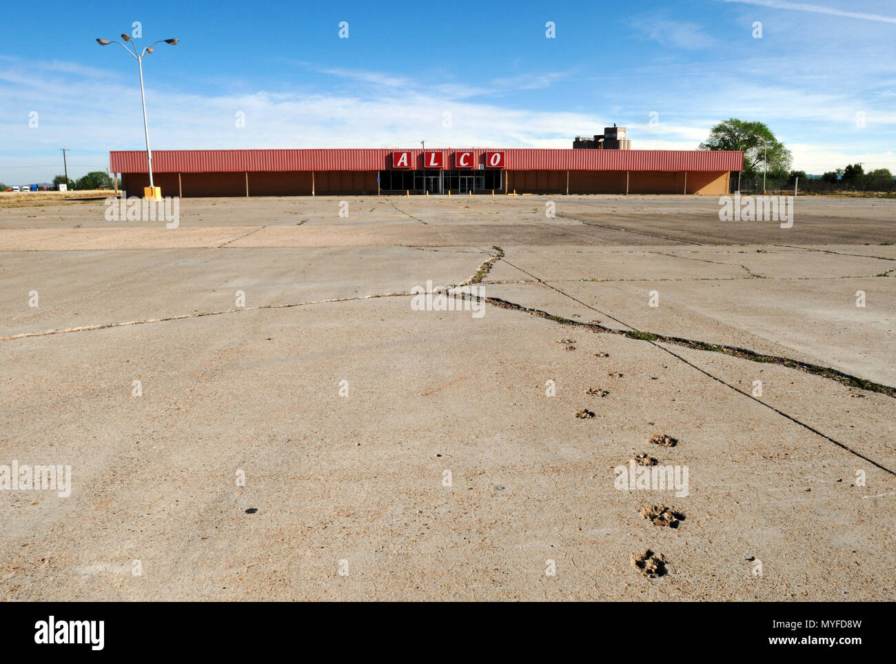 The empty parking lot at a closed ALCO store in Tucumcari, New Mexico. The American retail chain filed for bankruptcy in 2014. Stock Photo