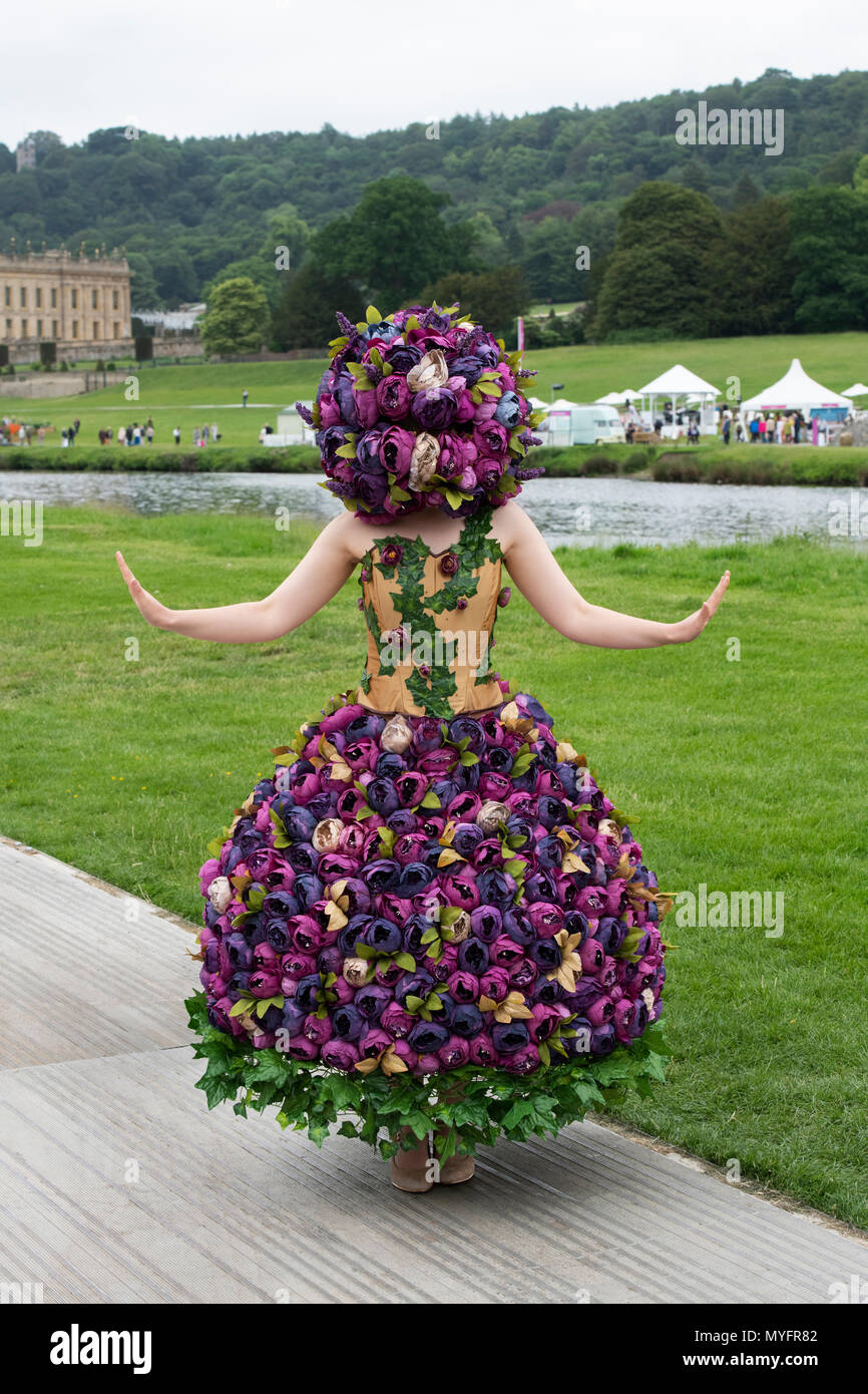 Woman wearing a floral outfit at RHS Chatsworth flower show 2018. Chatsworth, Bakewell, Derbyshire, UK Stock Photo