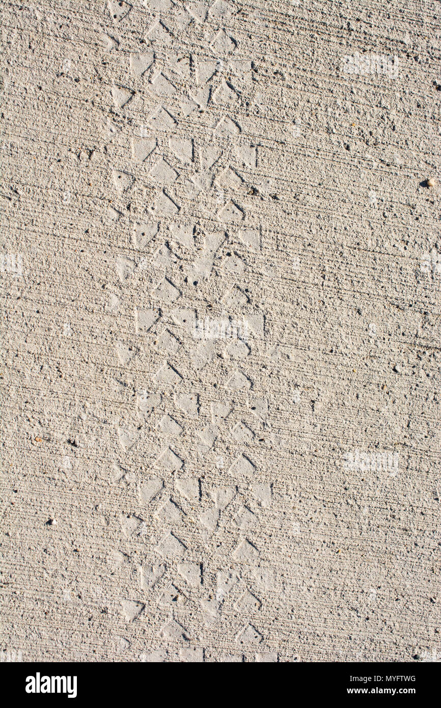 Tire tracks tire marks on Concrete as abstract grunge texture Stock