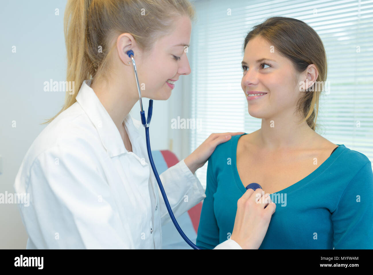 Patient Chest Doctor listening to patient's chest with stethoscope Stock Photo - Alamy