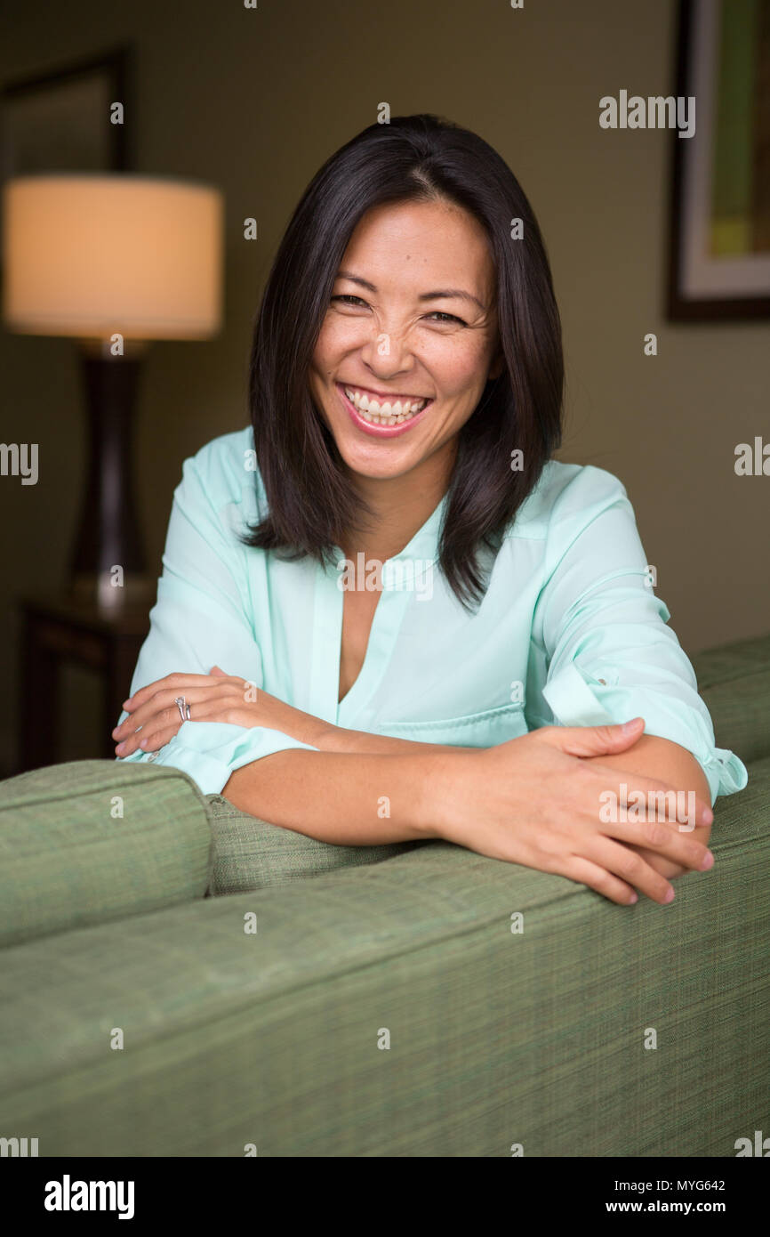 Portrait of an Asian woman laughing and smiling Stock Photo - Alamy