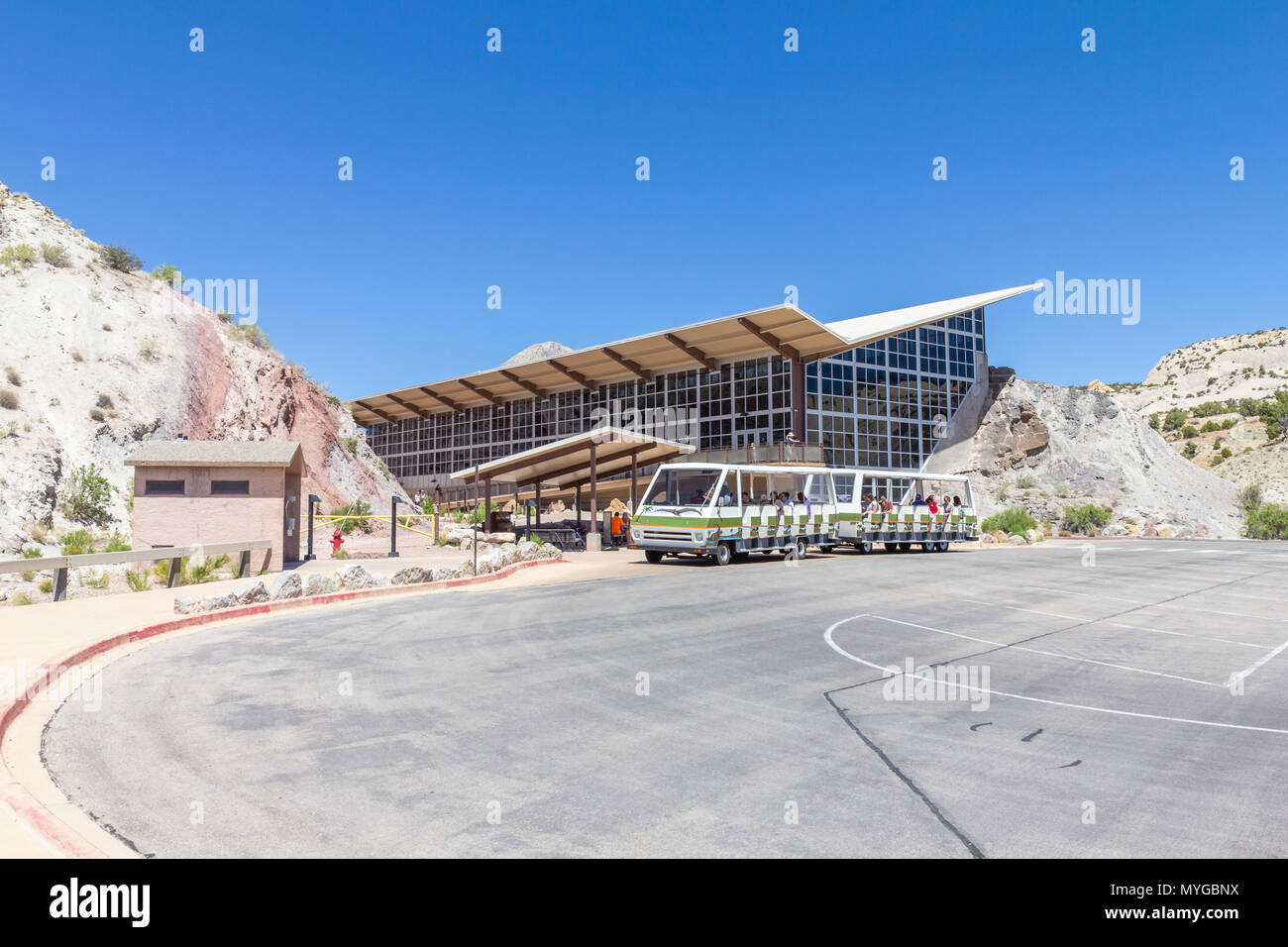 Shuttle parked in front of the Dinosaur Quarry Visitor Center at