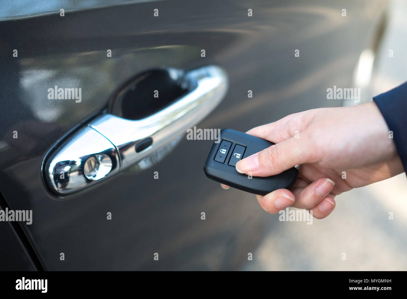 Close-up of female in formal wear opening a car door by remote Stock ...