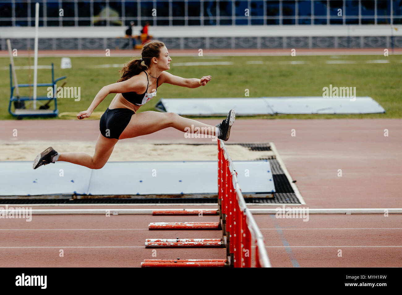 women athlete running in 100 meter hurdles during UrFO Championship in athletics Stock Photo