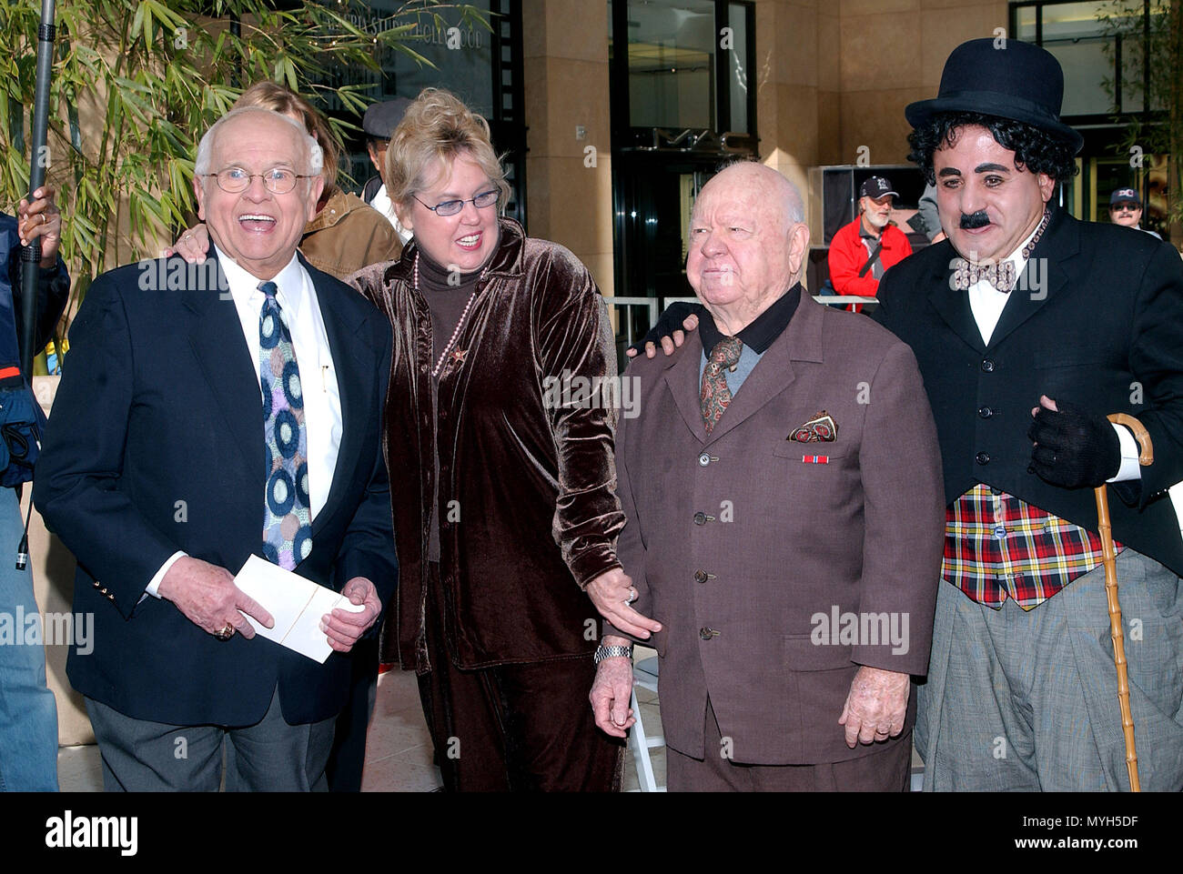 Johnny Grant received a star on the Hollywood walk of fame the day the Hollywood walk of fame has his 40th anniversary and Hollywood has his 115th anniversary. Johnny Grant posing with Mickey Rooney, his wife and charlie chaplin (from Universal studio). February 1st 2002.           -            GrantJ RooneyM w10.jpgGrantJ RooneyM w10  Event in Hollywood Life - California, Red Carpet Event, USA, Film Industry, Celebrities, Photography, Bestof, Arts Culture and Entertainment, Topix Celebrities fashion, Best of, Hollywood Life, Event in Hollywood Life - California, movie celebrities, TV celebrit Stock Photo