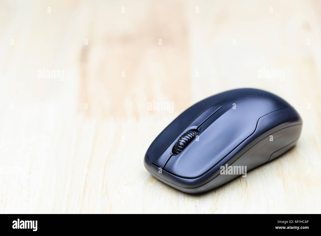 Computer wireless mouse on wood table for business, education and ...