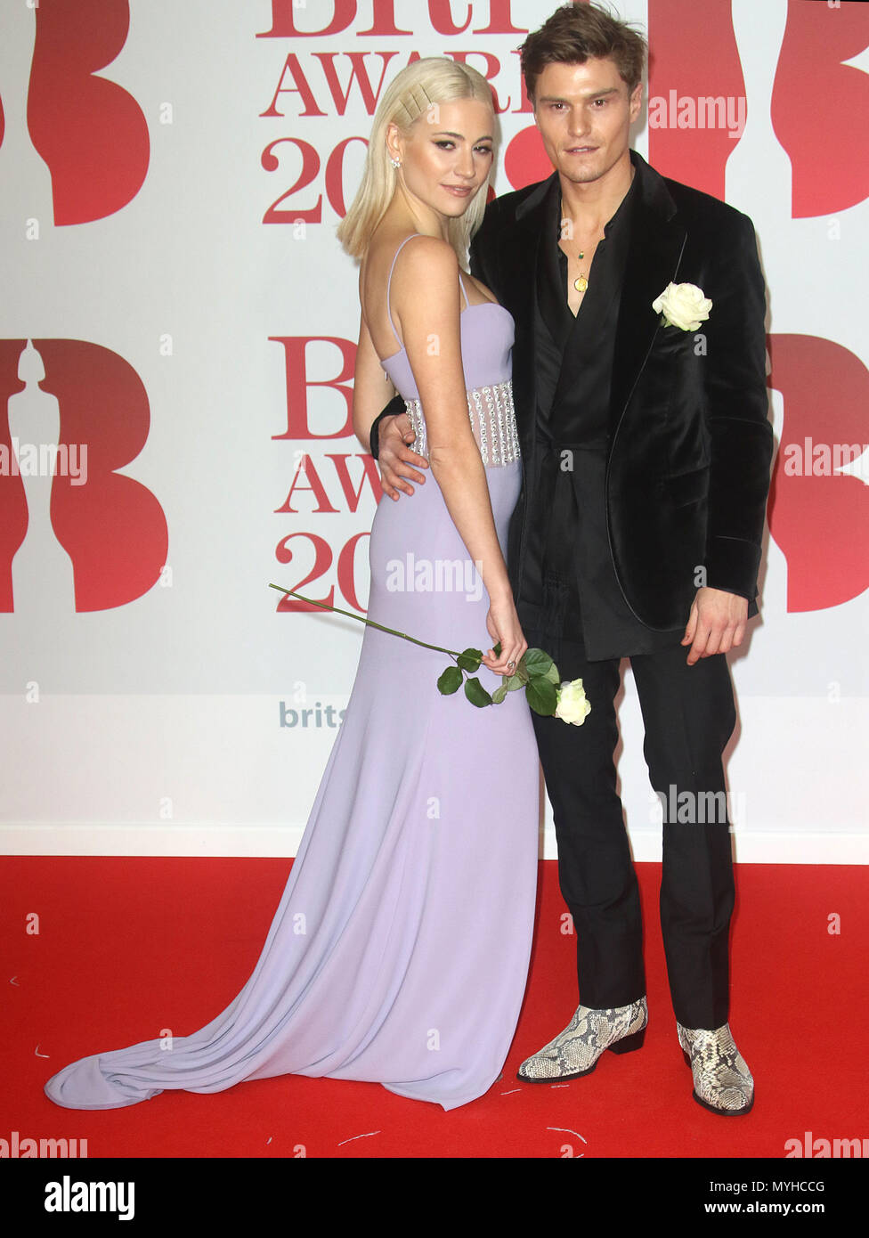 Feb 21, 2018  - Pixie Lott and Oliver Cheshire attending the BRITS Awards 2018 at O2 Arena in London, England, UK Stock Photo