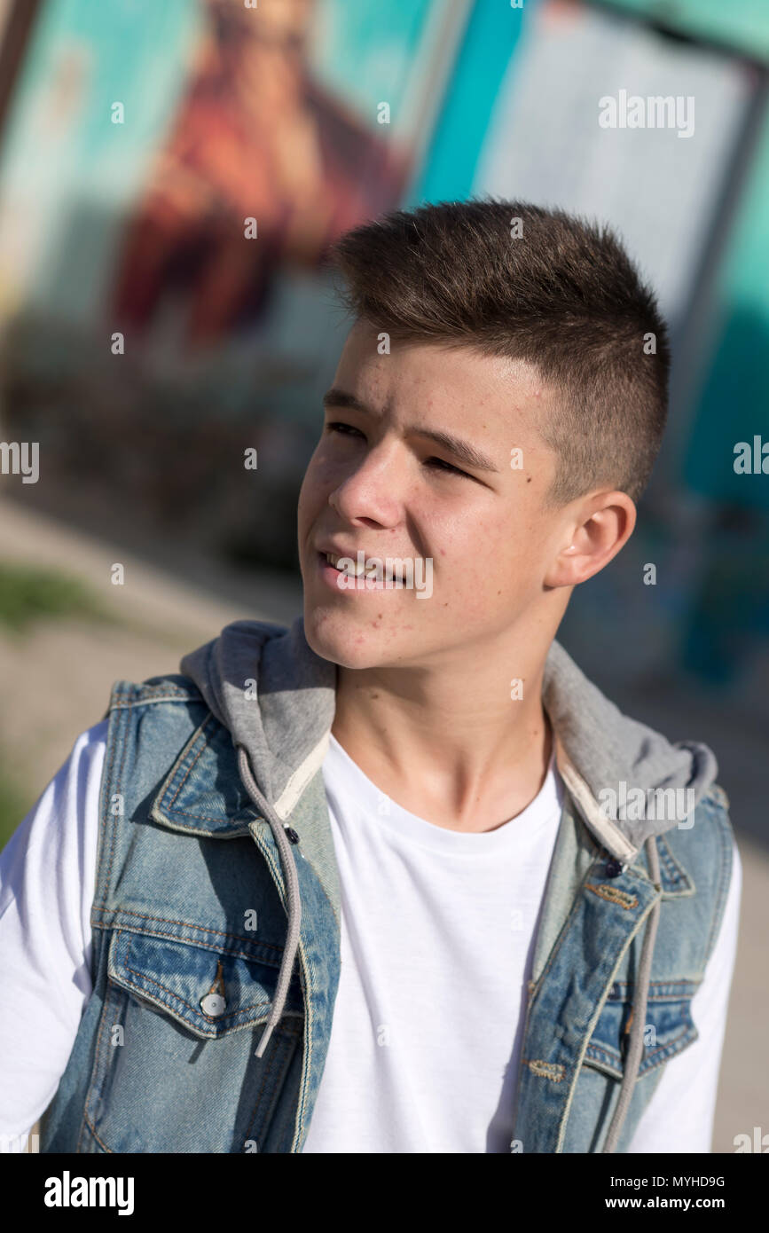 Portrait of Handsome teenage boy outdoors Stock Photo - Alamy