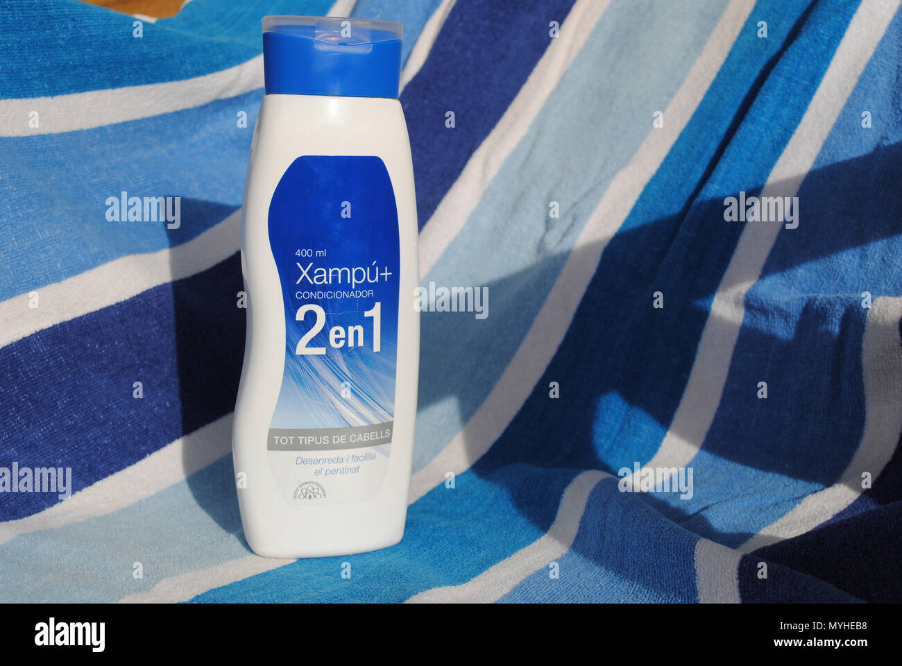 Locally made hair care product featuring all information on its label in Catalan. Stock Photo