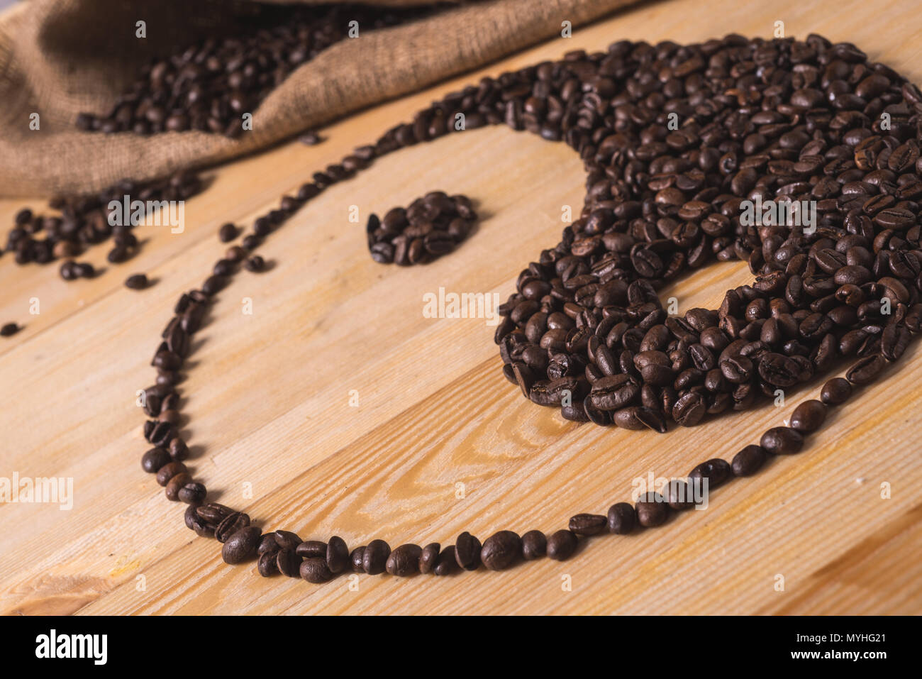ying yang coffee composition on wood table with warm light Stock Photo