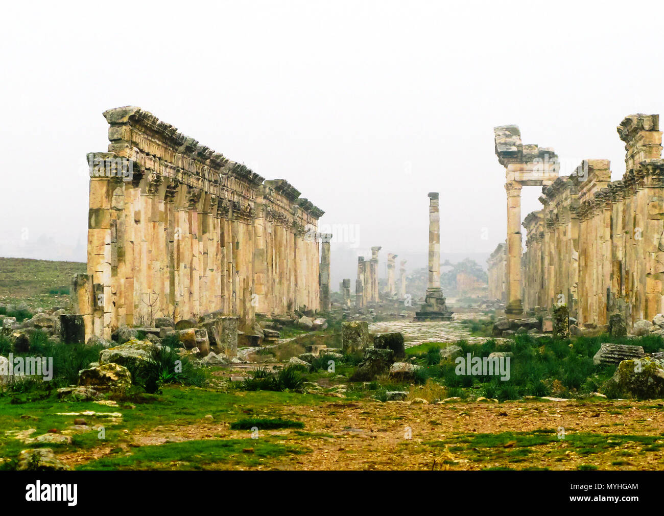 Great Colonnade at Apamea in fog, partially destroyed now, Syria Stock Photo