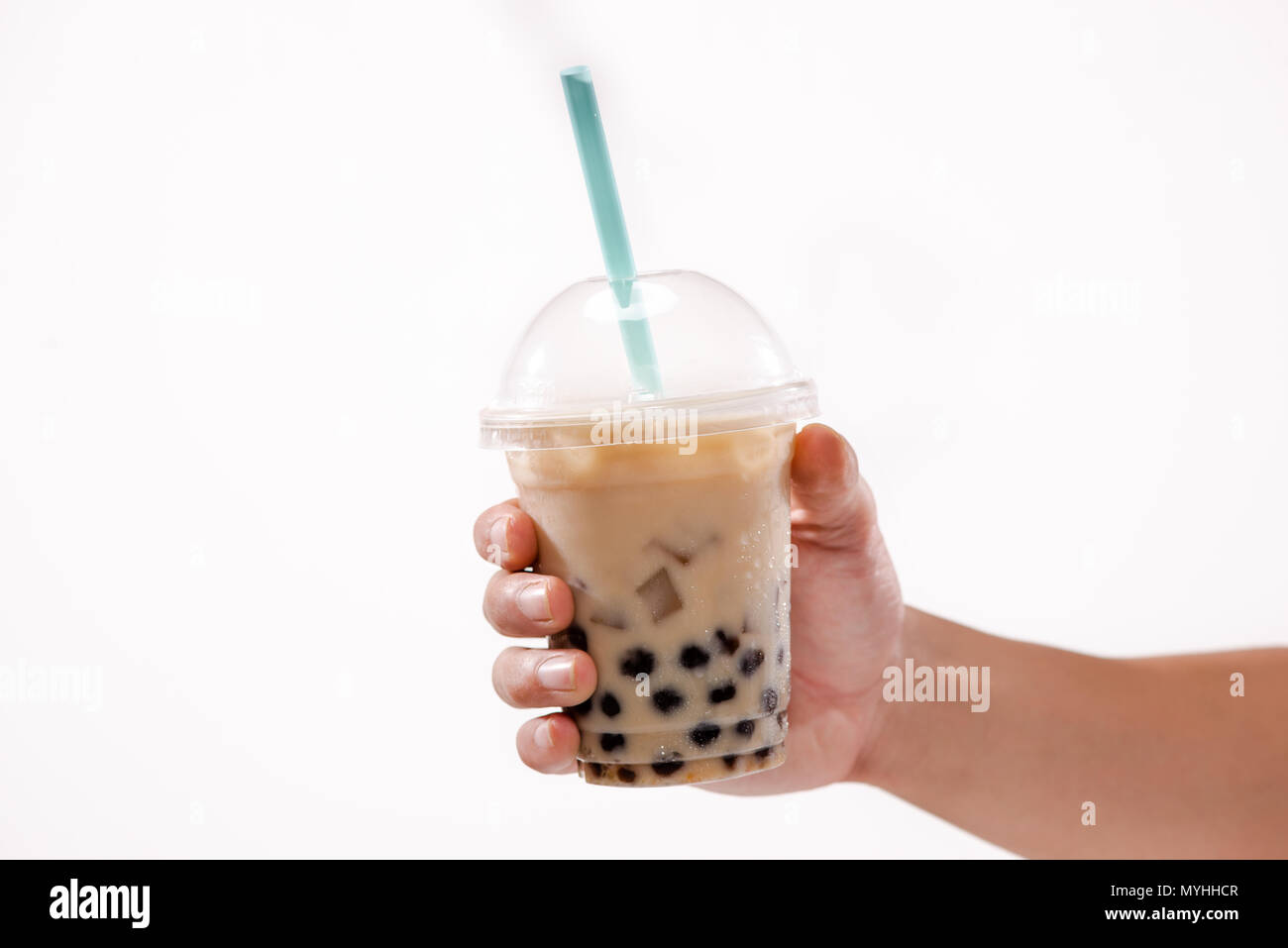 https://c8.alamy.com/comp/MYHHCR/holding-a-plastic-glass-of-refreshing-taiwan-iced-milk-tea-with-bubble-boba-MYHHCR.jpg