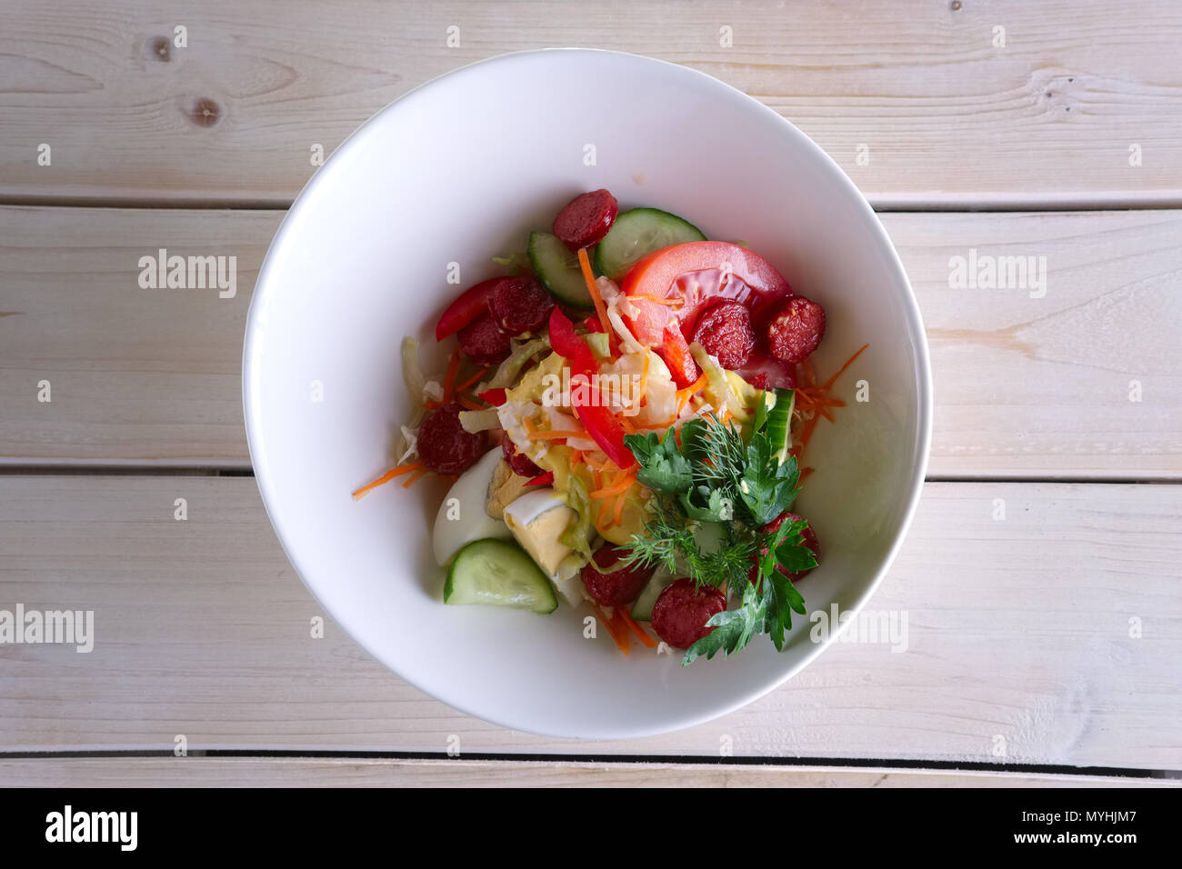 Salad with homemade sausage, egg, tomato, cucumber and mustard Stock Photo