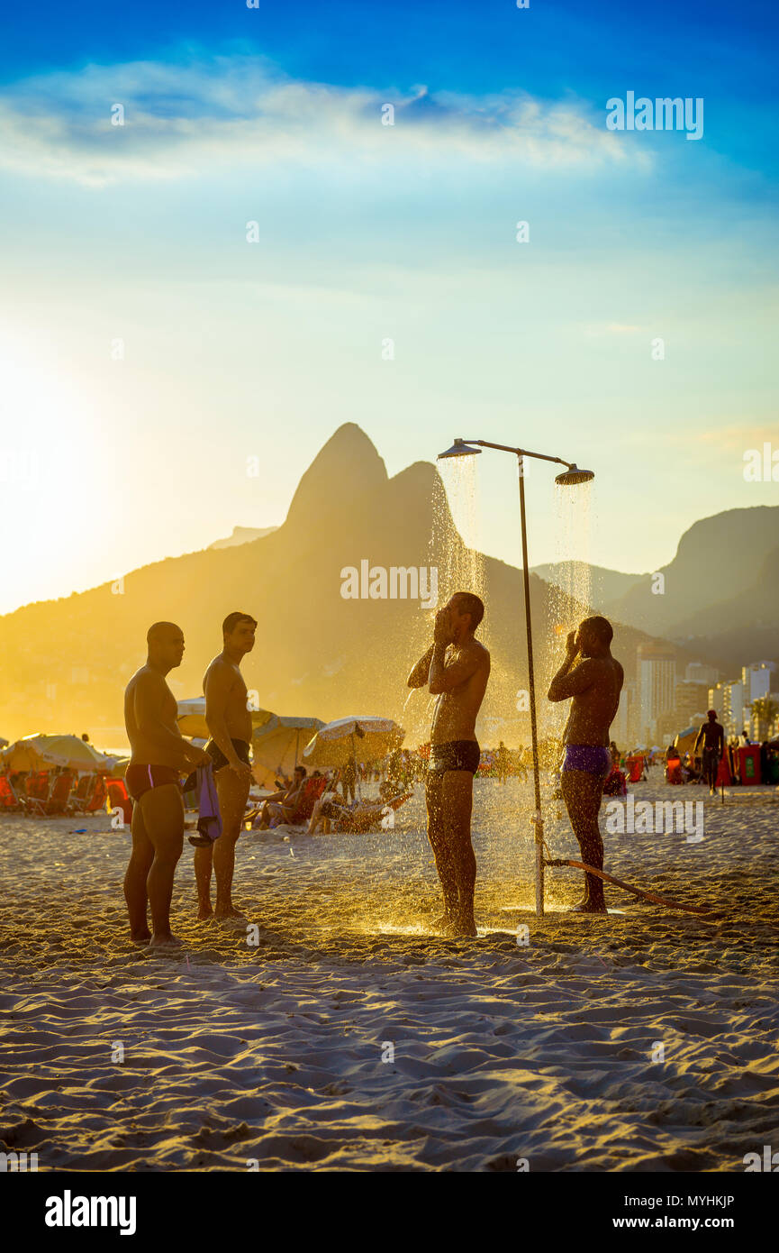Brazilian girls taking shower on Ipanema beach Shower beach brazil hi-res stock photography and images - Alamy