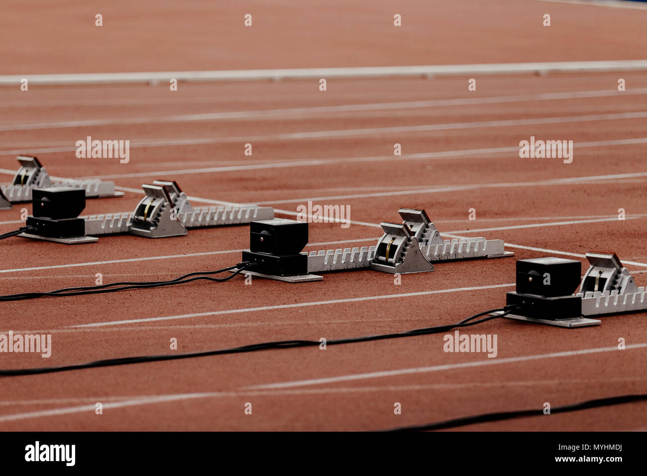 starting blocks with false start system on line100 meters running Stock Photo