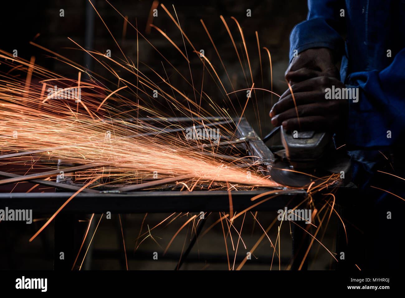 A metal worker on an Eastern Cape farm in South Africa. Farmers often establish small businesses to help pay for the costs of farming Stock Photo