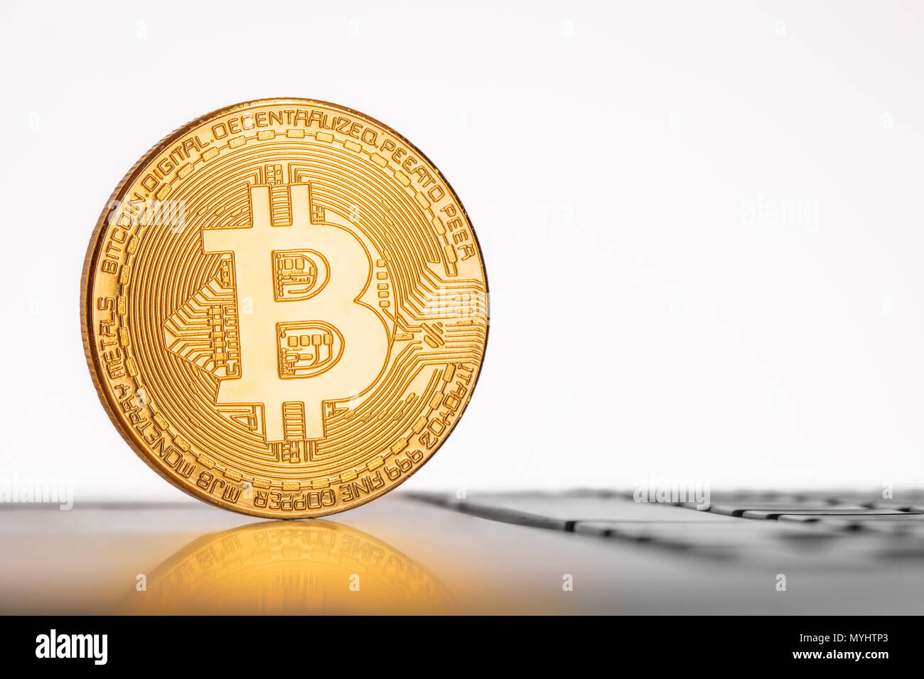 Cryptocurrency Bitcoin on keyboard with finances elements on background.  Blockchain technology concept Stock Photo - Alamy