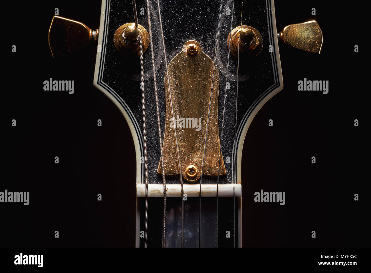 Details of an old dusty electric guitar. Stock Photo