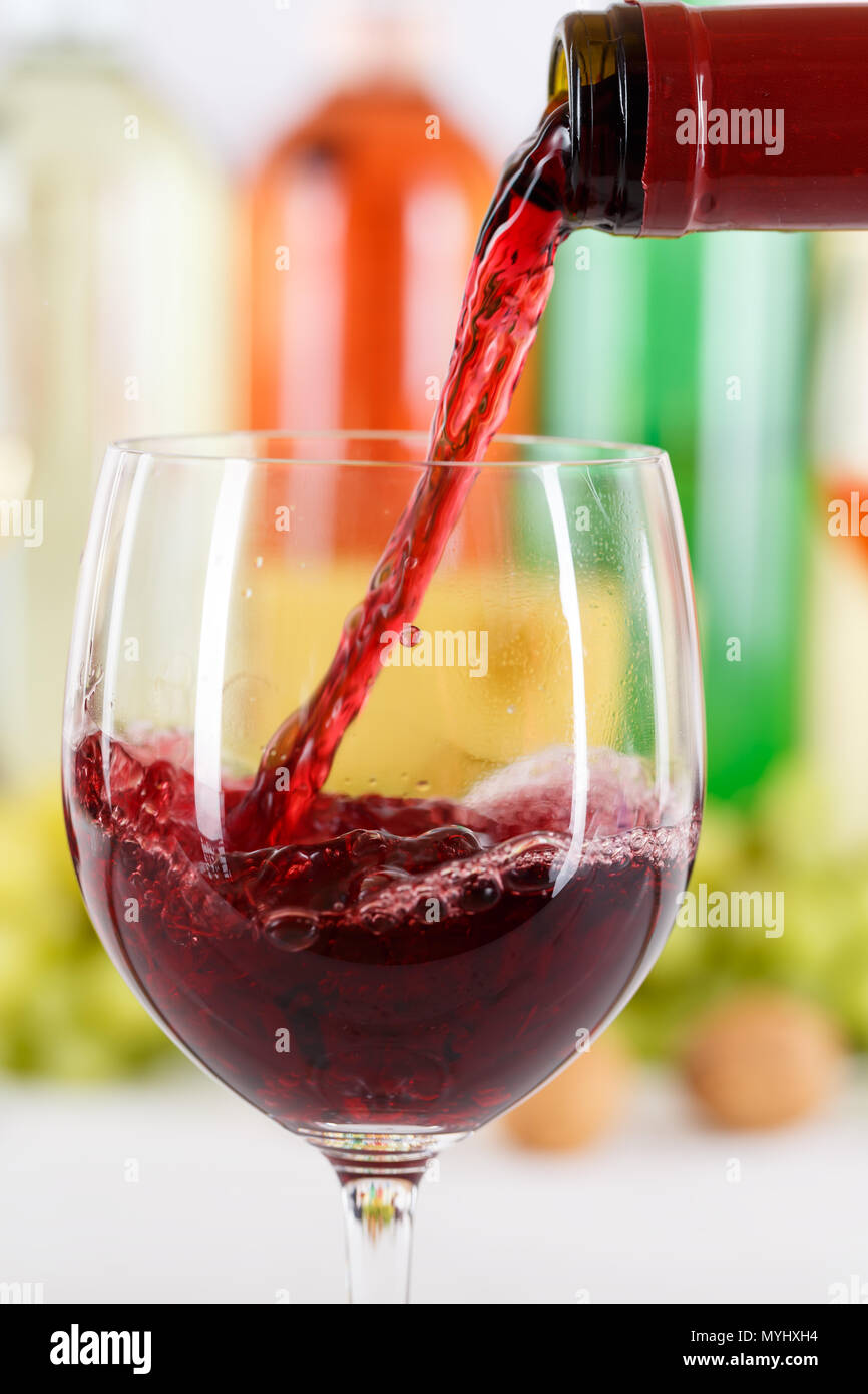 Wine pouring glass bottle red pour portrait format vertical Stock Photo
