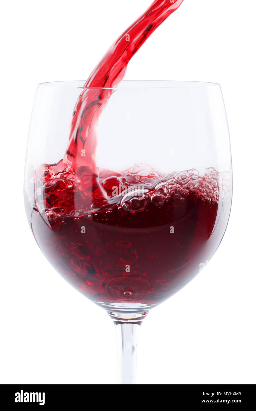 Wine pouring glass red pour portrait format isolated on a white background Stock Photo