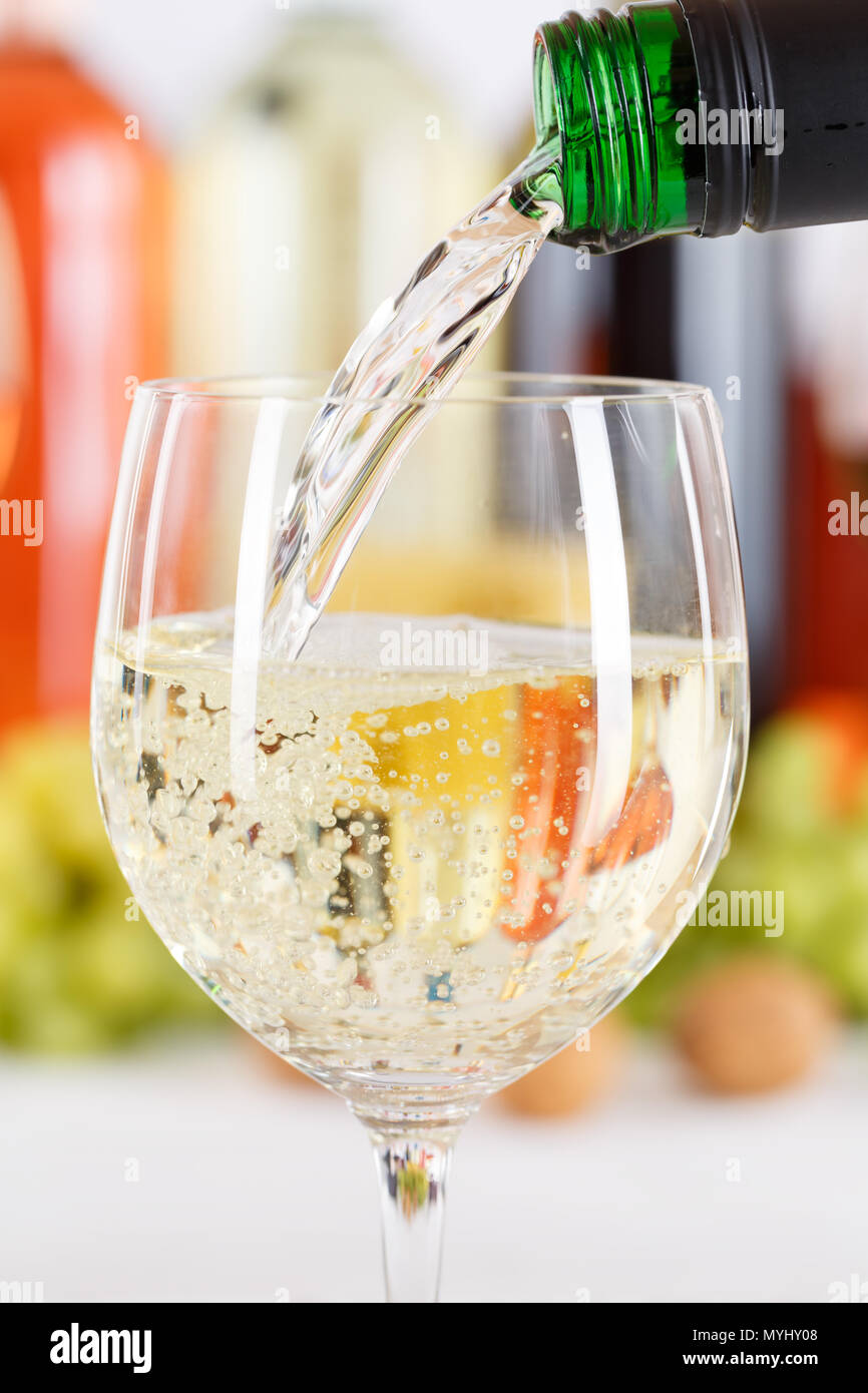 Wine pouring glass bottle white pour portrait format vertical Stock Photo