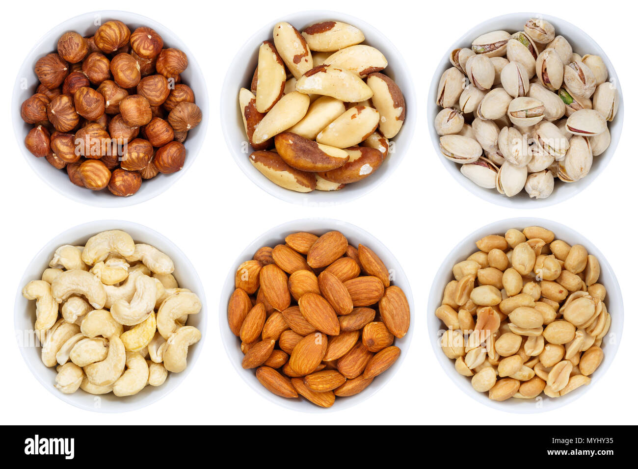 Nuts nut collection from above hazelnuts peanuts bowl isolated on a white background Stock Photo