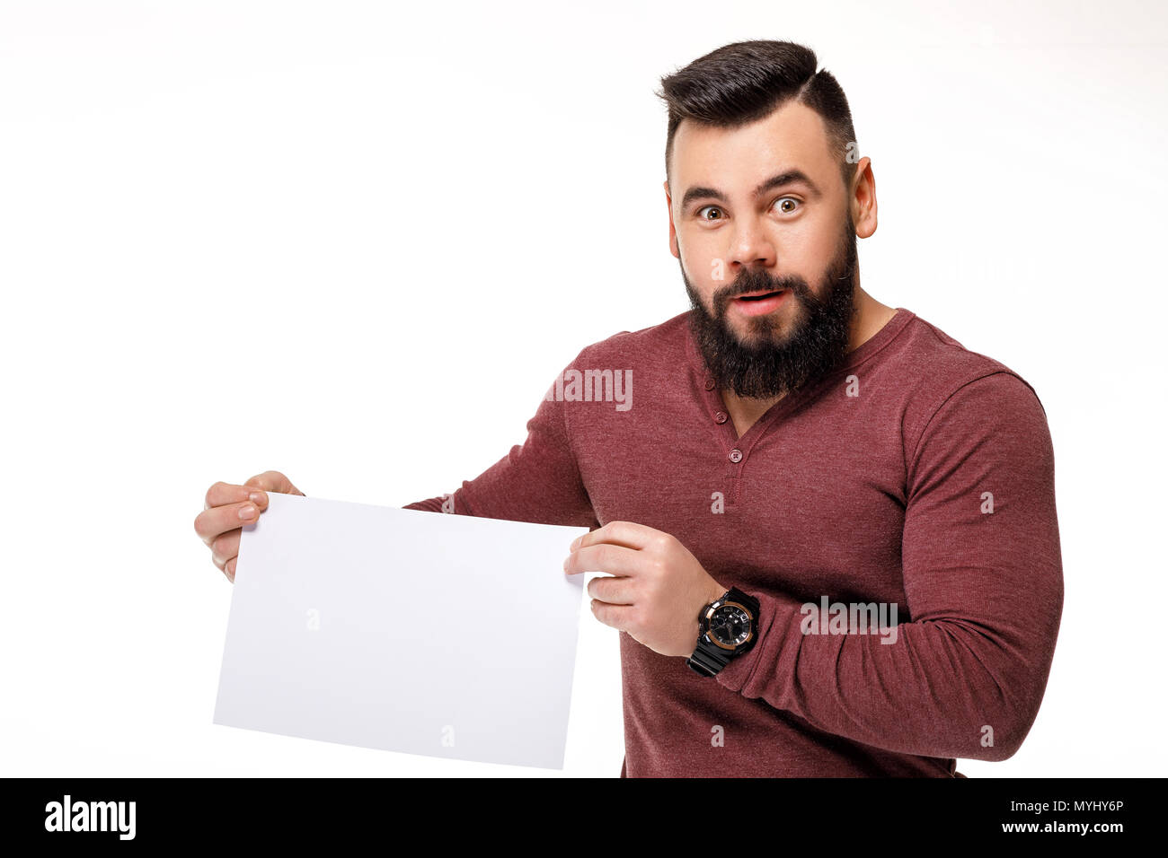 handsome bearded man holding white card. Stock Photo