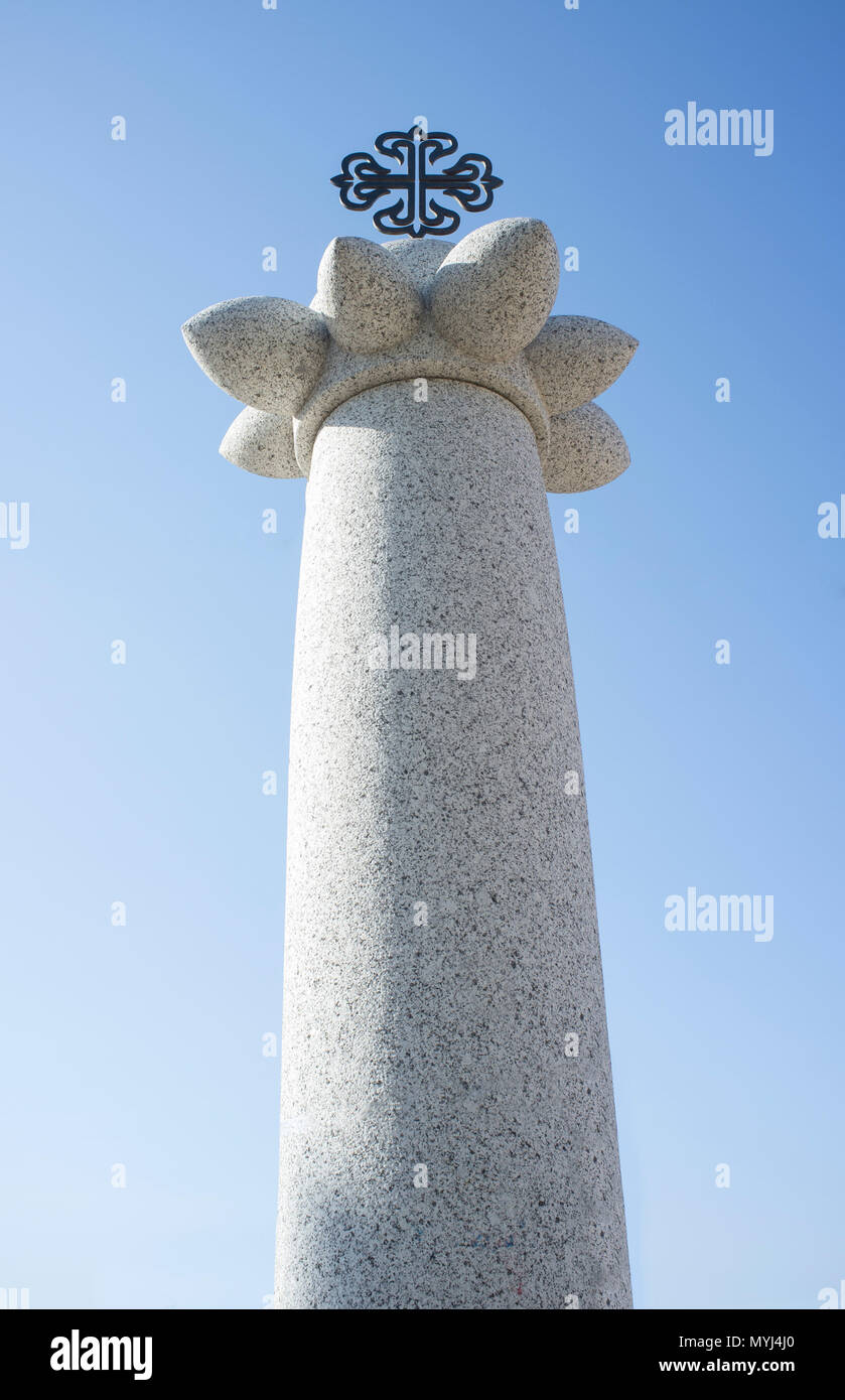 Granite monolith or pillory with Calatrava Orden Cross on the top. Saceruela, Spain Stock Photo