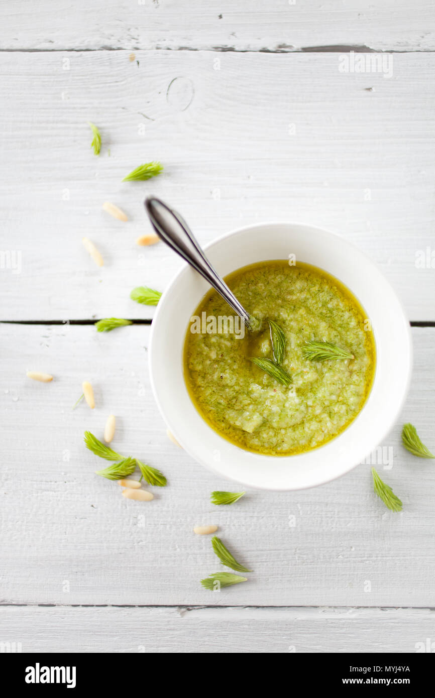 Homemade pesto with spruce sprouts, parmesan, pinenuts and lemon Stock Photo
