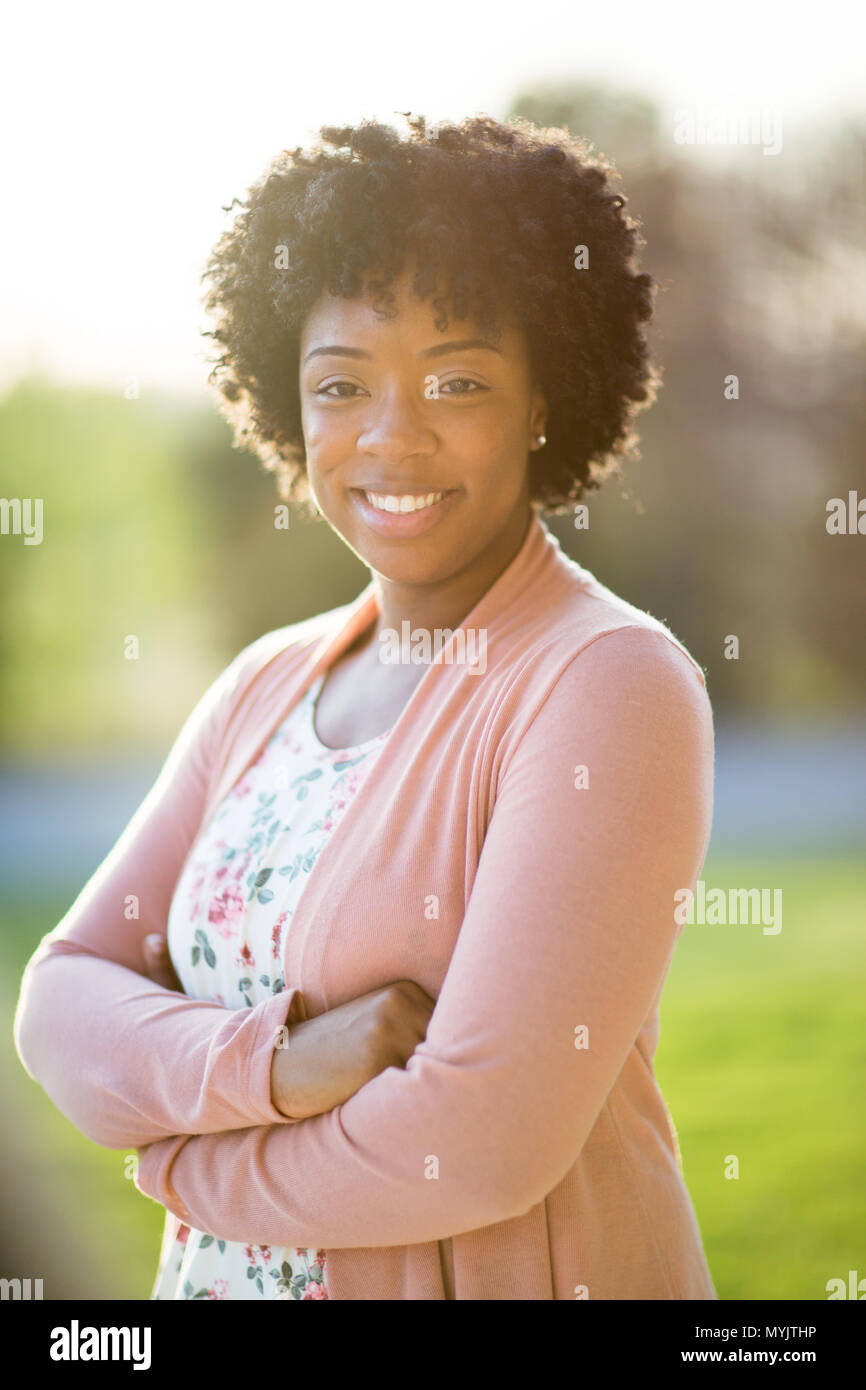 Happy young African American woman smiling outside Stock Photo - Alamy