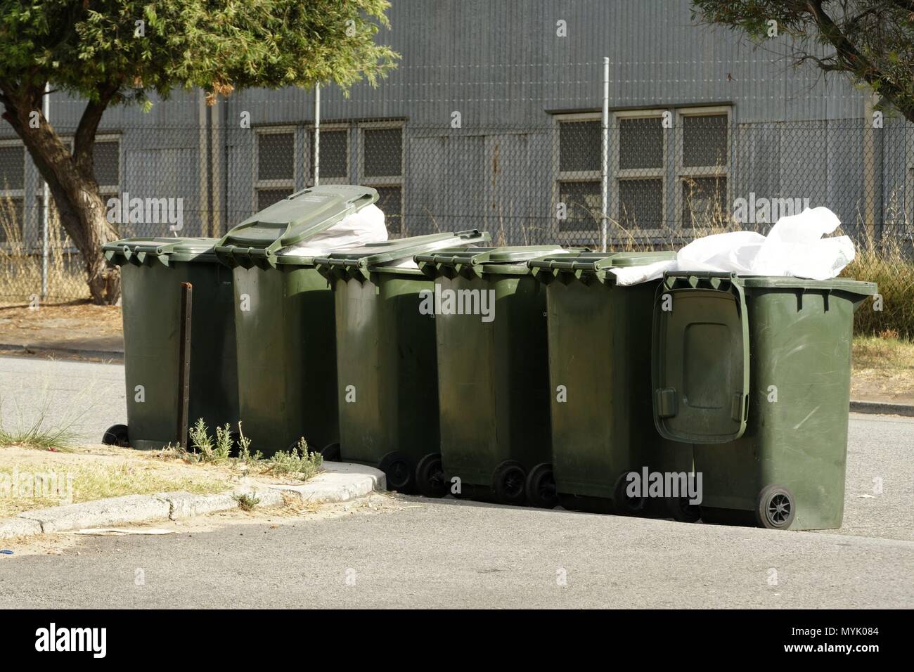 Wheelie rubbish bins on side of road, Perth, Western Australia March