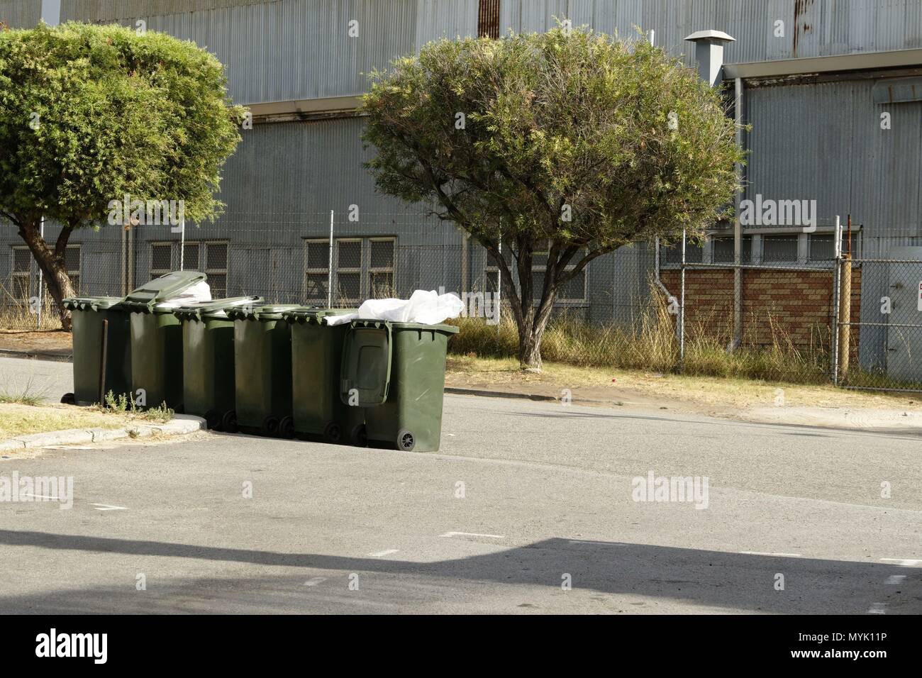Wheelie rubbish bins on side of road, Perth, Western Australia March