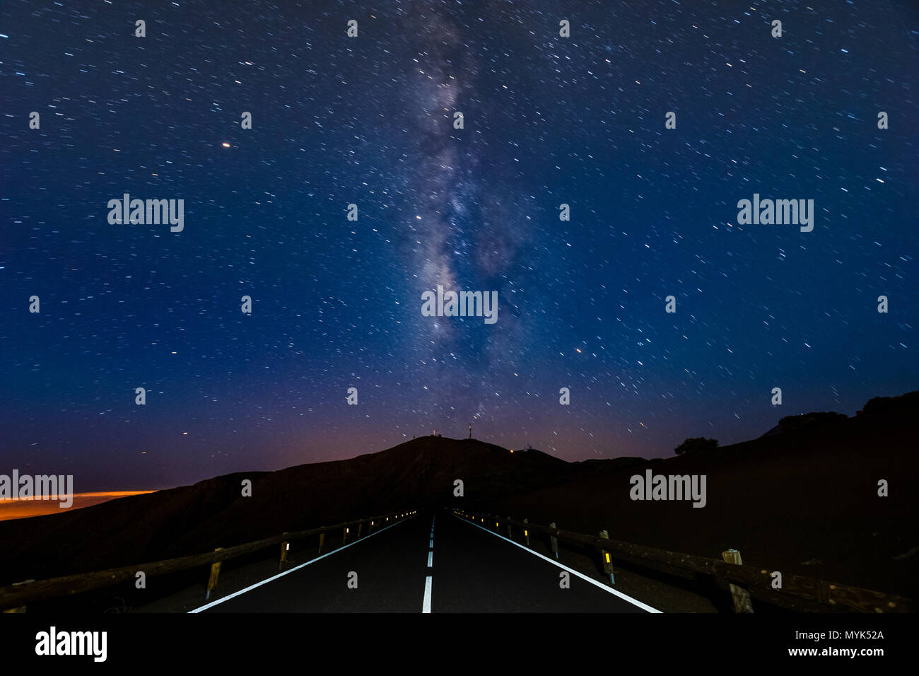 Night sky - a milky way over the road at night Stock Photo - Alamy