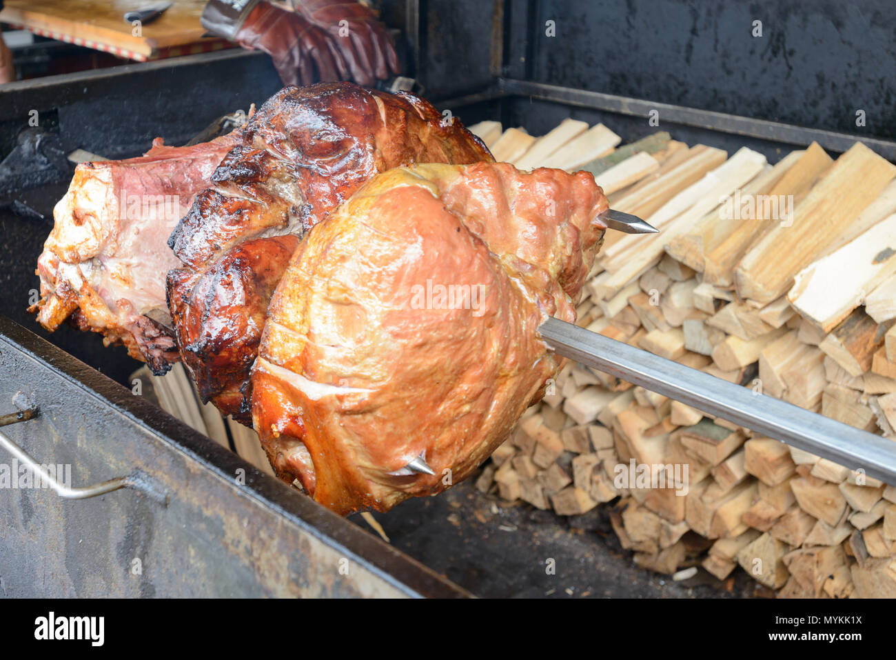 Prague Ham is traditionally served in restaurants and from street vendors with a side of boiled potatoes  and often accompanied by Czech beer. Stock Photo