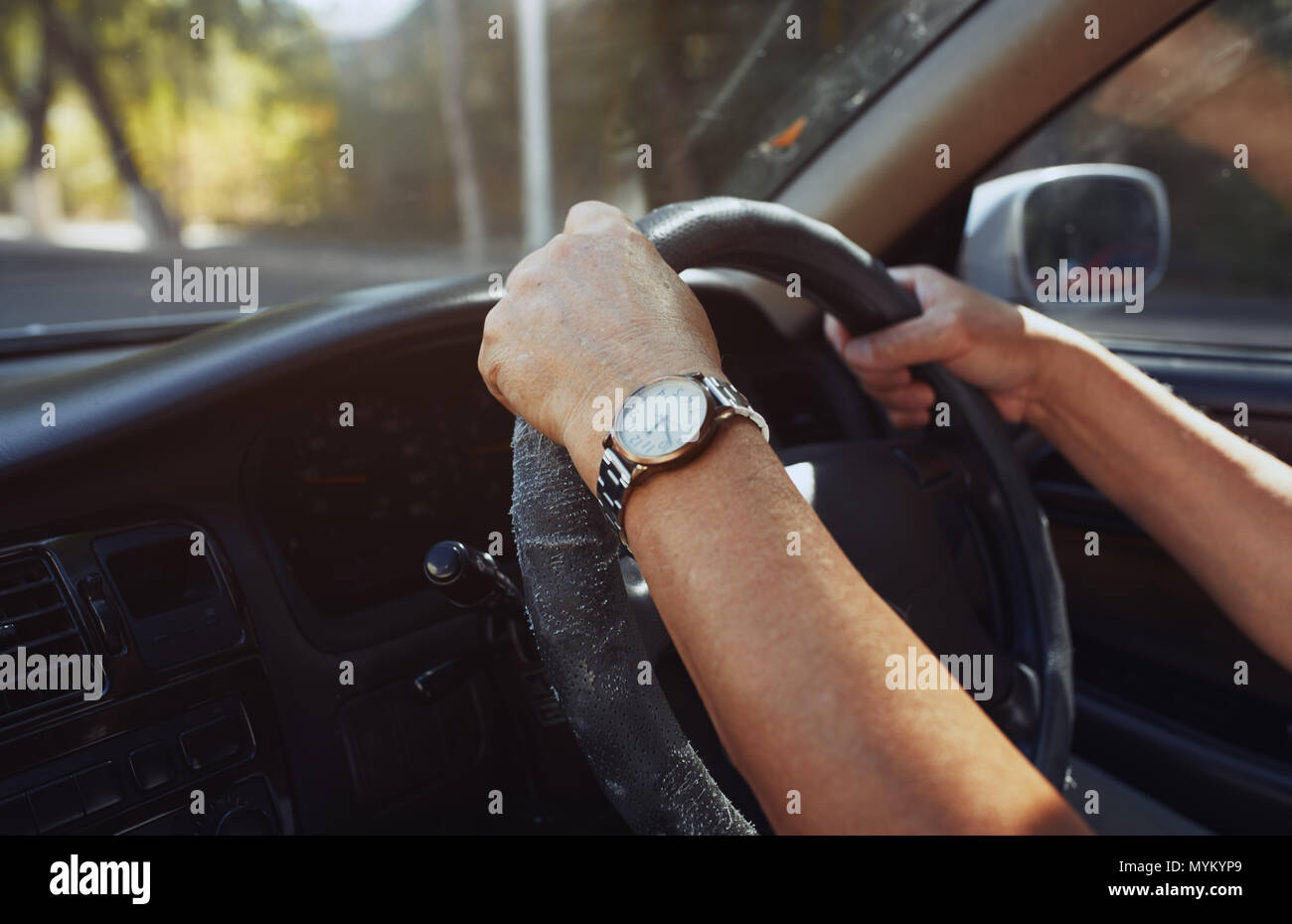 Senior 65-70 years man driving car Stock Photo