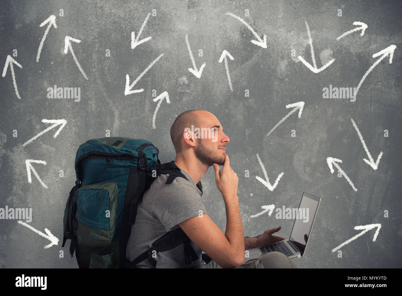 Explorer plans a new travel with his laptop Stock Photo