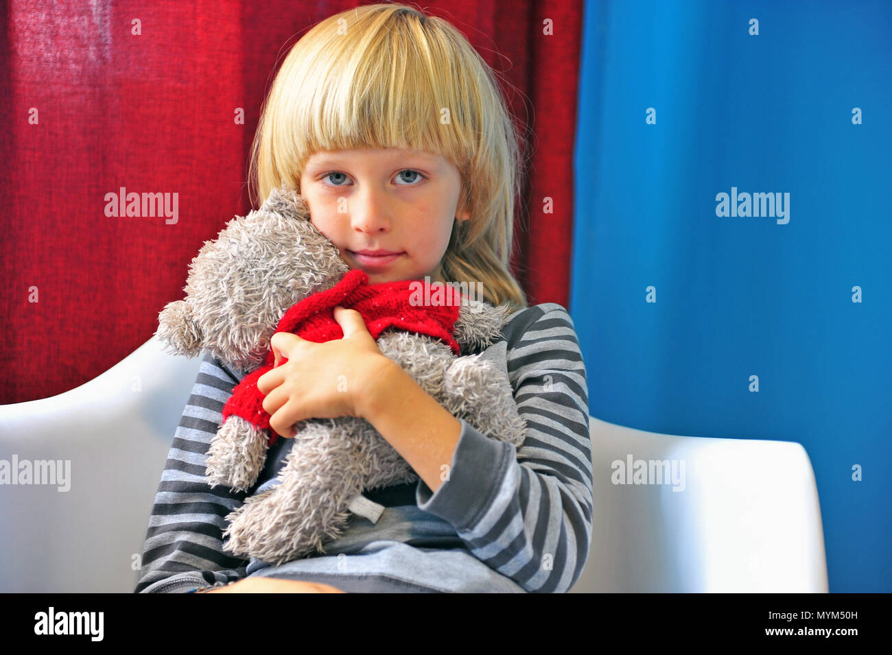 Cute little boy hugging with teddy bear Stock Photo - Alamy