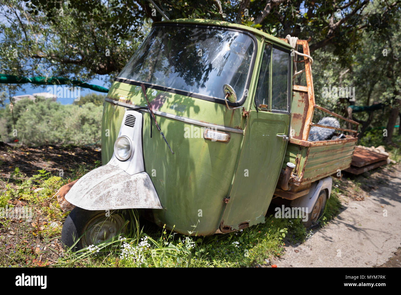Abandoned and rusty Piaggio Ape 3 wheeler, Termini, Campania, Italy, Europe Stock Photo