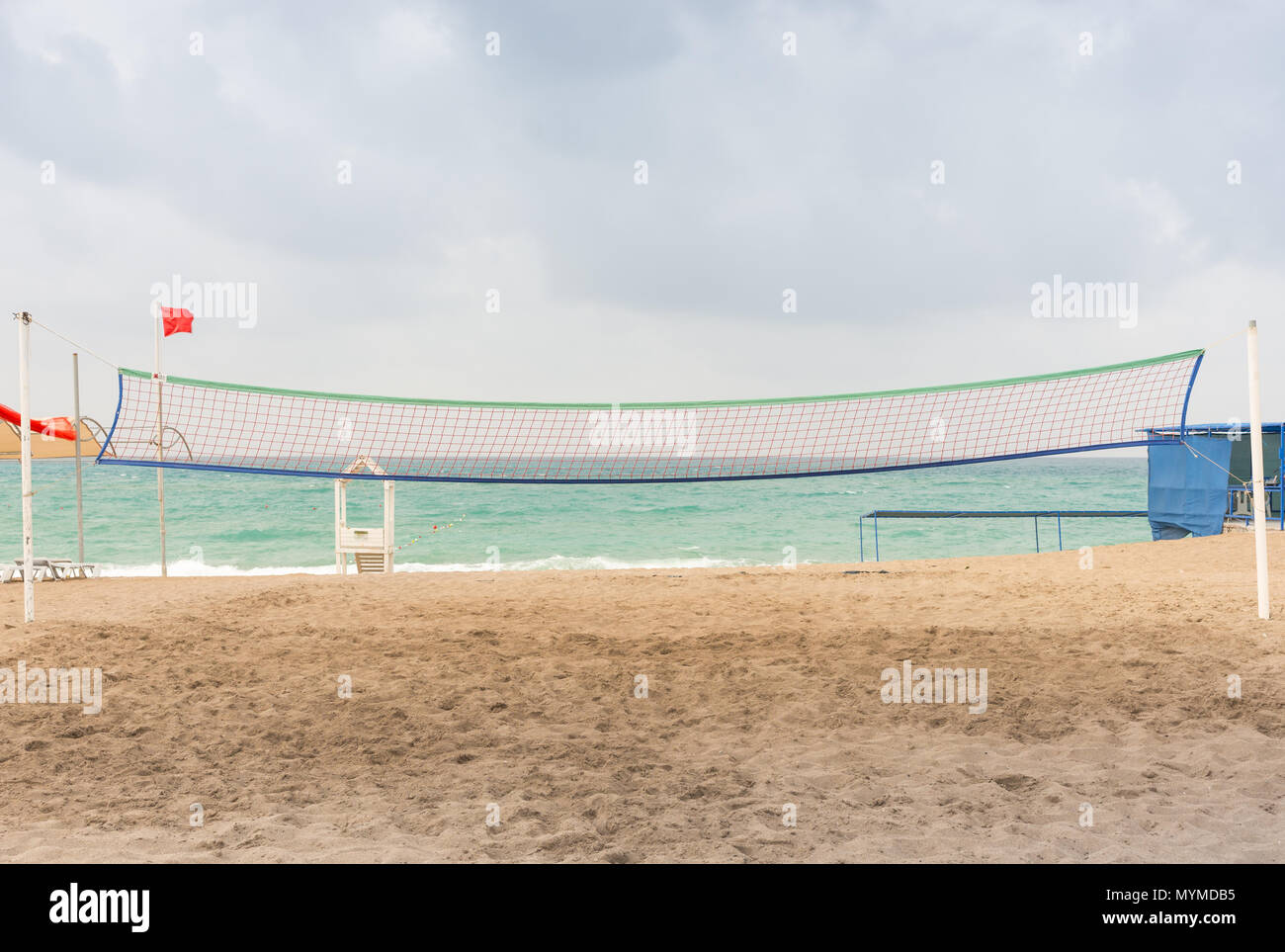 Beach Volleyball Net On Sandy Beach With Sea And Blue Sky In The