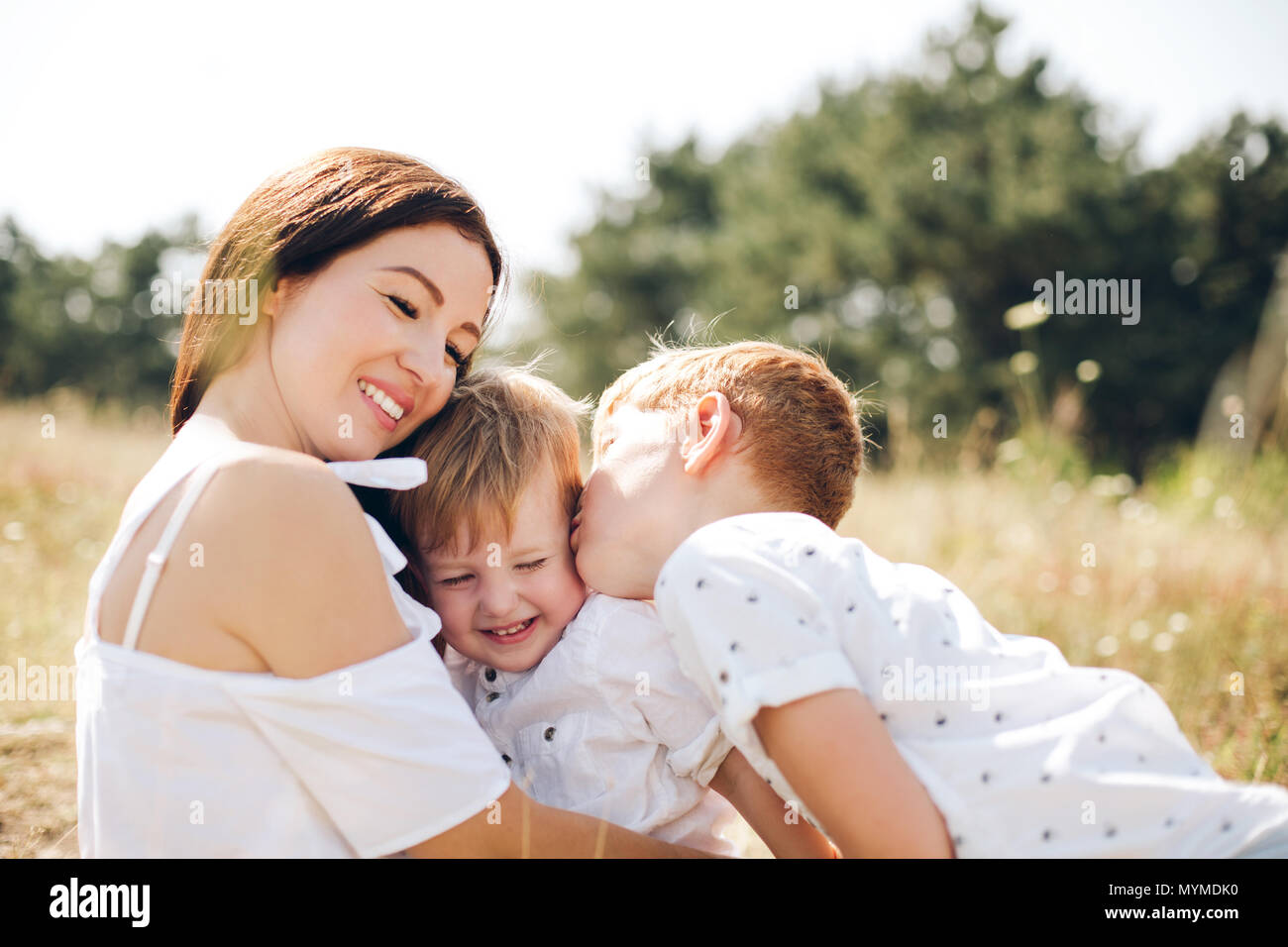 Mother with two sons Stock Photo