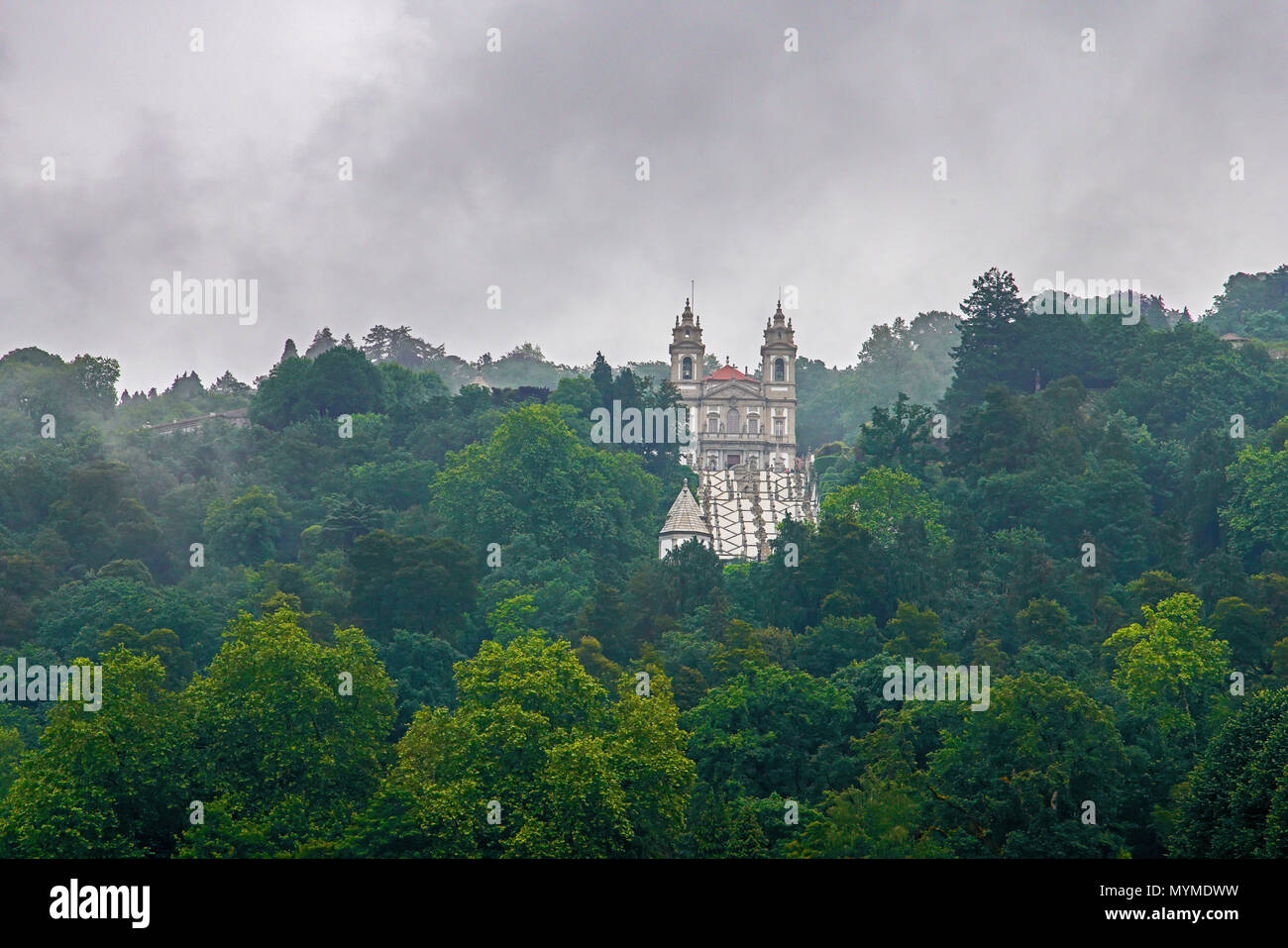 Bom Jesus do Monte church surrounded by forest and clouds. Braga. Stock Photo